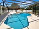 Backyard oasis featuring pool and spa with large screened-in enclosure, perfect for relaxation and recreation at 4993 Heatherstone Pl, Orlando, FL 32812