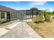 Backyard showcasing a screened-in pool area and lush landscaping at 4993 Heatherstone Pl, Orlando, FL 32812