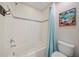 Well-lit bathroom featuring a shower-tub combination and modern fixtures at 5156 Oakbourne Ave, Davenport, FL 33837