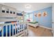 Themed bedroom with a bunk bed, twin bed, and playful Mario Bros wall art at 5156 Oakbourne Ave, Davenport, FL 33837