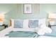 Bedroom with a queen bed, designer pillows, and an artistic wall decor at 5156 Oakbourne Ave, Davenport, FL 33837