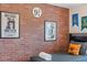 The bedroom features fun Harry Potter decor and a brick accent wall at 5156 Oakbourne Ave, Davenport, FL 33837