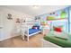 Fun bedroom with a bunk bed, twin bed, and colorful Mario Bros themed decor at 5156 Oakbourne Ave, Davenport, FL 33837