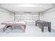 Spacious game room with air hockey and foosball tables for indoor fun at 5156 Oakbourne Ave, Davenport, FL 33837