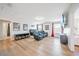 Living room with theatre seating, large screen TV, and adjacent bedroom and bathroom at 5156 Oakbourne Ave, Davenport, FL 33837