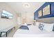 Comfortable main bedroom with a king bed, stylish decor, and ample natural light at 5156 Oakbourne Ave, Davenport, FL 33837