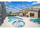 Inviting screened-in pool and spa area with outdoor seating at 5156 Oakbourne Ave, Davenport, FL 33837