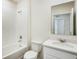 Bathroom featuring shower-tub combo, sink, and white cabinets at 5258 Scrub Mint, Apopka, FL 32712