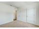 Bright bedroom featuring carpet floors and two white doors at 5258 Scrub Mint, Apopka, FL 32712