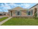 Charming single-story home with stone accents, lush lawn and appealing blue shutters at 5258 Scrub Mint, Apopka, FL 32712