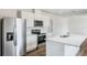 Modern kitchen featuring stainless steel appliances, island, white cabinetry and stylish countertops at 5258 Scrub Mint, Apopka, FL 32712