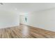 Bright living room with wood flooring and a large window at 5258 Scrub Mint, Apopka, FL 32712