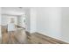 Open-concept area with wood-look flooring and light, connecting living spaces at 5258 Scrub Mint, Apopka, FL 32712