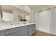 Modern bathroom boasting dual sinks, stylish gray cabinetry, and a pristine glass-enclosed shower at 5282 Scrub Mint Ln, Apopka, FL 32712