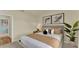 Well-decorated bedroom with a comfortable bed, stylish artwork, natural light, and a tranquil ambiance at 5282 Scrub Mint Ln, Apopka, FL 32712