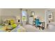 Comfortable bedroom with twin bed, desk, and neutral color palette, creating a calming atmosphere at 5282 Scrub Mint Ln, Apopka, FL 32712