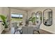 Bright dining room with round marble table, seating for four, modern decor and large sliding glass doors at 5282 Scrub Mint Ln, Apopka, FL 32712