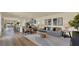 Open-concept living room with modern furniture, stylish decor, and seamless flow into the kitchen at 5282 Scrub Mint Ln, Apopka, FL 32712