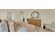 Relaxing bedroom featuring king bed, dresser, and views to other rooms for a stylish, open feel at 5282 Scrub Mint Ln, Apopka, FL 32712