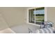 Covered patio featuring comfortable seating and serene views for outdoor relaxation and enjoyment at 5282 Scrub Mint Ln, Apopka, FL 32712