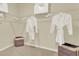 Organized walk-in closet with shelving, hanging space, and storage bins for efficient wardrobe management at 5282 Scrub Mint Ln, Apopka, FL 32712