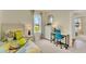 Bright bedroom featuring a twin bed, study space, and natural light, perfect for a or young adult at 5290 Scrub Mint Ln, Apopka, FL 32712
