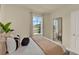 Comfortable bedroom with a large window and stylish full-length mirror at 5290 Scrub Mint Ln, Apopka, FL 32712