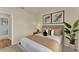 Inviting bedroom features neutral decor, a comfortable bed and lots of natural light at 5290 Scrub Mint Ln, Apopka, FL 32712