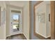 Inviting entryway featuring a white front door with glass and neutral walls with art at 5290 Scrub Mint Ln, Apopka, FL 32712