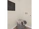Clean and functional laundry room with a stylish basket and wall decor at 5290 Scrub Mint Ln, Apopka, FL 32712
