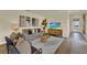 Bright and open living space with stylish furnishings and a view towards the entry at 5290 Scrub Mint Ln, Apopka, FL 32712