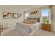 Serene bedroom with neutral tones, plush bedding, and abundant natural light from two large windows at 5290 Scrub Mint Ln, Apopka, FL 32712