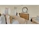 Spacious bedroom with a large bed, elegant decor, and a connected bathroom providing comfort and convenience at 5290 Scrub Mint Ln, Apopka, FL 32712
