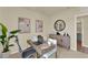 A home office featuring a light wood desk, comfortable seating and stylish decor at 5290 Scrub Mint Ln, Apopka, FL 32712