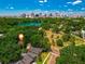 Stunning aerial view of the neighborhood with the house marked, featuring a lake and city skyline at 604 Cherokee Dr, Orlando, FL 32801