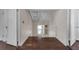 Rustic attic space featuring wood floors, white walls, and rustic ceiling beams at 604 Cherokee Dr, Orlando, FL 32801