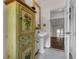 Elegant bathroom with a pedestal sink, floral cabinet, and mosaic tile flooring at 604 Cherokee Dr, Orlando, FL 32801