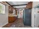 Well-lit kitchen with brick flooring, classic wooden cabinets, and modern appliances at 604 Cherokee Dr, Orlando, FL 32801
