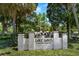 Entrance sign for Lake Davis, a downtown neighborhood, surrounded by lush landscaping and mature trees at 604 Cherokee Dr, Orlando, FL 32801