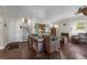 Comfortable living room with hardwood floors, fireplace, vintage furniture, and a staircase to the upper level at 604 Cherokee Dr, Orlando, FL 32801