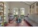 Cozy living room with brick floors, arched windows and neutral colored furniture at 604 Cherokee Dr, Orlando, FL 32801
