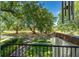 Scenic view of the park from the balcony with lush green trees at 604 Cherokee Dr, Orlando, FL 32801