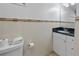 Bathroom featuring a granite countertop and updated lighting at 6165 Carrier Dr # 1304, Orlando, FL 32819