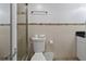 Modern bathroom with glass shower, updated fixtures and tiled walls at 6165 Carrier Dr # 1304, Orlando, FL 32819