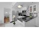 Contemporary kitchen with granite counters and stainless steel appliances at 6165 Carrier Dr # 1304, Orlando, FL 32819