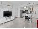 Open-concept living space with modern furnishings and tile flooring at 6165 Carrier Dr # 1304, Orlando, FL 32819