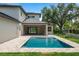 Beautiful backyard featuring a pool with pavers, and a modern home at 705 N Lake Sybelia Dr, Maitland, FL 32751