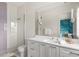 Modern bathroom featuring stylish vanity and a glass-enclosed shower with tiled wall at 705 N Lake Sybelia Dr, Maitland, FL 32751