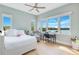 Light and airy bedroom with a large window showcasing the water view at 705 N Lake Sybelia Dr, Maitland, FL 32751