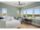 Comfortable bedroom with a serene view of the lake, bringing the outdoors in at 705 N Lake Sybelia Dr, Maitland, FL 32751